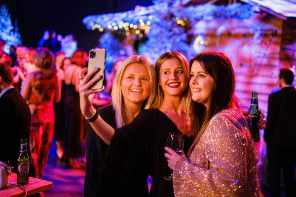 Girls taking a selfie at Christmas Party